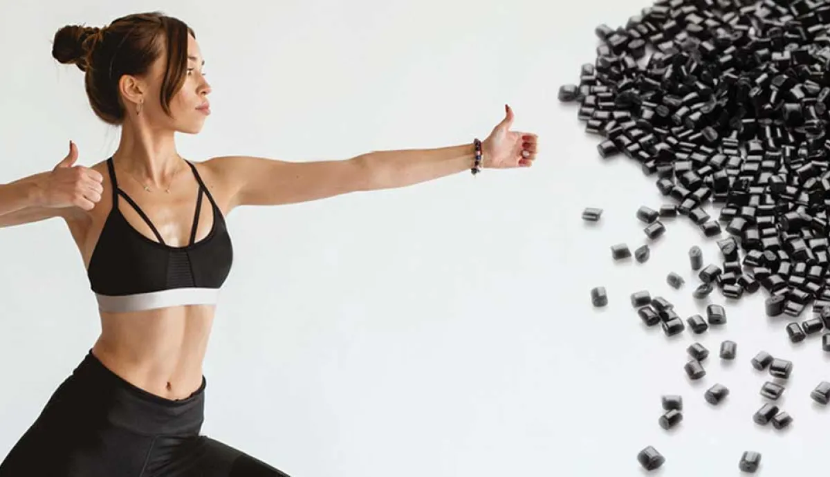 Female doing yoga and black pellets
