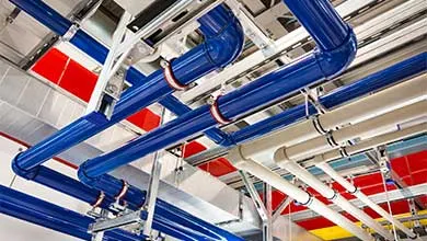 Pipes of different colors in an industrial building