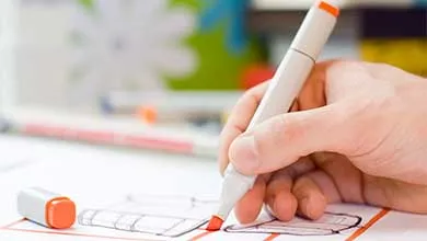 A designer drawing sketches