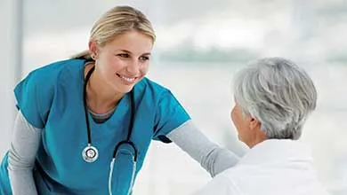 Young Doctor Speaking With an Elderly Patient
