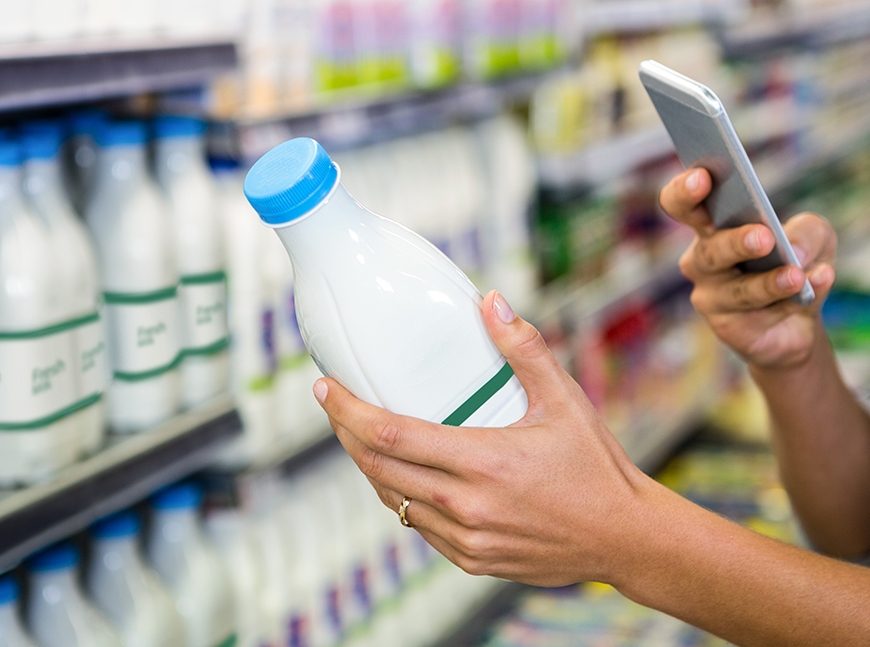 female holding milk bottle