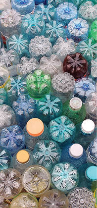 Dirty used colored plastic bottle pile.